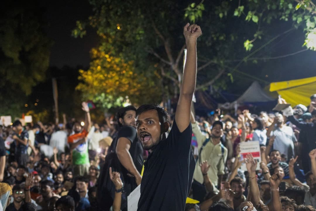 Thousands protest in India after clashes, despite Modi assuring action on exams